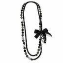 Collana lunga danza con charm scarpetta e fiocco nero