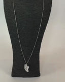 Collana lunga con ciondolo scarpetta da punta